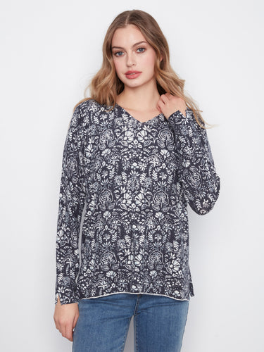 Floral top with a graceful V-neck, perfect for casual outings. The long sleeves add elegance to any look. By Charlie B.