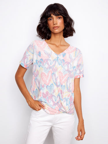 Vibrant heart-printed T-shirt showcasing a stylish V-neckline, perfect for casual outings by Charlie B.