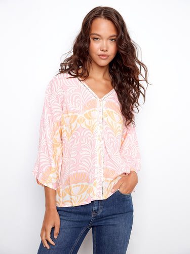 Delicate ladder stitch detail enhances the sophisticated style of this versatile top by Charlie B.