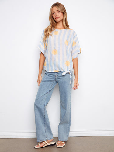 Dolman sleeve top in lightweight fabric with a boat neckline and sunny embroidery for a breezy look by Charlie B.