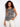 This sleeveless design top features a striking pattern, perfect for warm weather styling. The relaxed fit adds comfort. By Charlie B.