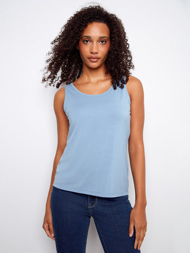 Light blue tank top featuring a reversible design for versatile styling. The scoop neck adds a classic touch. By Charlie B.