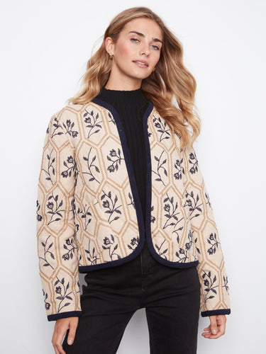 Open front jacket with intricate floral patterns, perfect for layering over casual outfits. Designed by Charlie B.