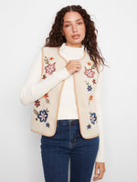 Sleeveless vest with crew neck and floral embroidered sherpa side, perfect for versatile styling by Charlie B.