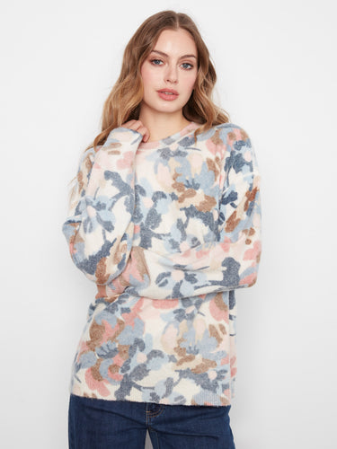 Floral sweater with a classic crew neck, offering a stylish and comfortable fit for any casual outing. By Charlie B.