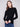 Black ribbed knit sweater featuring a chic mock neck design, perfect for versatile styling by Charlie B.