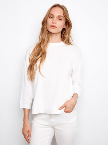 White cotton sweater featuring a crew neckline and stylish 3/4 sleeves, designed for comfort by Charlie B.