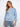 Soft blue top with a classic crew neckline, offering a relaxed fit ideal for casual wear. Crafted from 100% cotton by Charlie B.