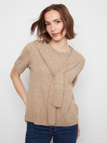 Beige sweater featuring a crew neckline, perfect for a casual day out. The soft knit fabric ensures comfort and style by Charlie B.