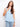 Light blue sleeveless top with a scoop neckline, featuring side button detailing for a stylish touch. By Charlie B.