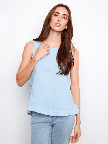 Light blue sleeveless top with a scoop neckline, featuring side button detailing for a stylish touch. By Charlie B.