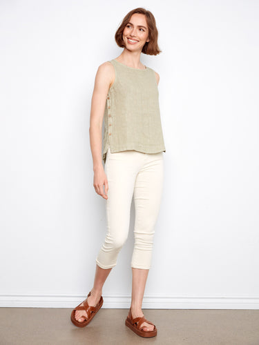 This top features a stylish high-low hem, adding a modern touch to your casual wardrobe. Ideal for layering. By Charlie B.