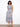 This dress features a V-neck design and wide straps, offering a stylish yet comfortable fit for any occasion. By Charlie B.