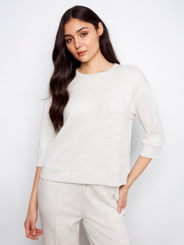 Elevate your look with this piece's unique blanket stitch detailing, blending simplicity with sophistication by Charlie B.