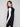Chic black vest showcasing a zip front closure and attached hood for versatile styling by Charlie B.