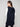 Fashionable black long vest designed with an attached hood and practical zip closure by Charlie B.