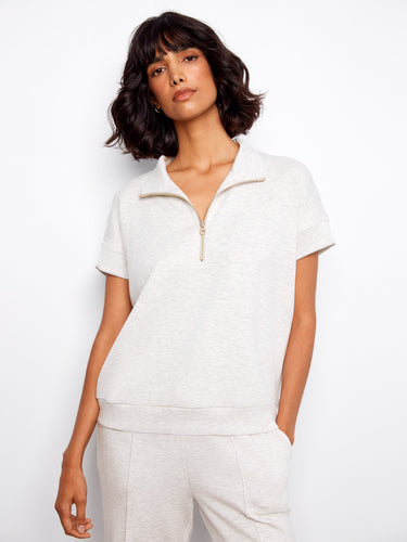 Light grey top with a stylish half-zip feature, perfect for casual outings. The short sleeves add comfort and ease by Charlie B.