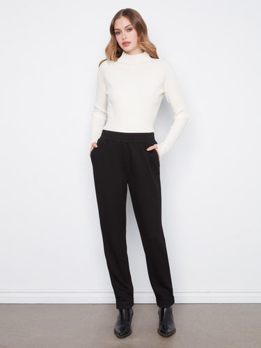 These pants feature a stylish tapered fit, offering a modern silhouette for any occasion. Crafted with care by Charlie B.