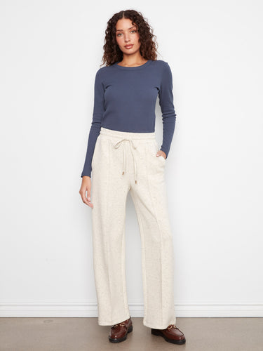 Wide leg pants feature a comfortable elastic waistband with drawstring, perfect for casual wear by Charlie B.