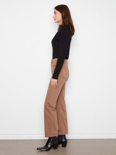 The zip fly and button closure add functionality to these chic pants, blending practicality with style effortlessly. By Charlie B.