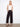 Black pants with a wide leg fit and cropped length, showcasing patch pockets. Designed for style and comfort by Charlie B.