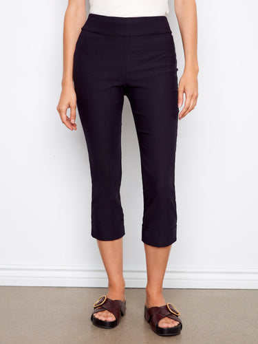 Crafted with stretch fabric, these capri pants ensure ease of movement and style in every step. By Charlie B.