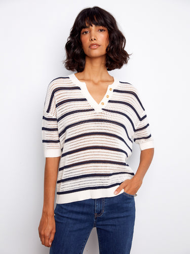 Striped top featuring a stylish notch neckline and button accents, perfect for casual outings. Designed by Charlie B.