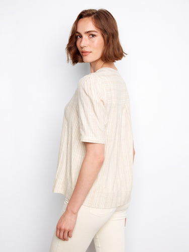 Elegant light beige blouse crafted from a soft cotton blend by Charlie B.