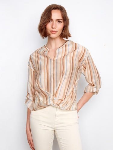 The blouse features a split notch neckline, enhancing its stylish appeal with a touch of elegance. By Charlie B.
