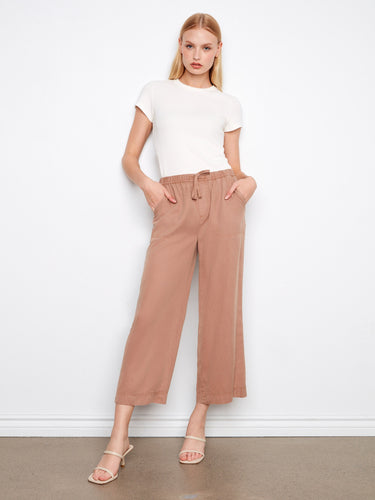 These pants feature a wide leg design, offering a relaxed and stylish look for any casual outing. By Charlie B.