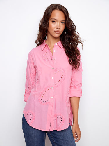 Pink blouse featuring a classic shirt collar with intricate eyelet details, perfect for a stylish look by Charlie B.