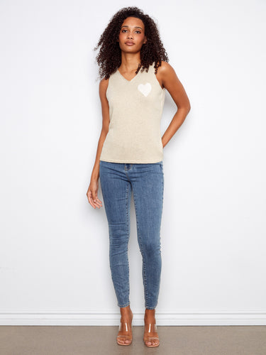 Elegant V-neck gold cami with sleeveless design and subtle heart embellishment by Charlie B.