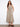 Elegant dress featuring a V-neckline and sleeveless design, perfect for warm weather. By Charlie B.