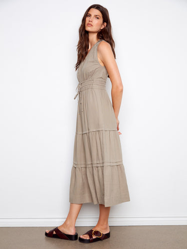 Stylish maxi length dress with a tiered design that adds volume and movement. By Charlie B.