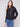 Black faux leather jacket featuring a stylish hook-and-eye closure for added elegance by Charlie B.