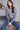 Stylish heather grey sweater featuring shimmering sequins and comfortable drop shoulders by Charlie B.