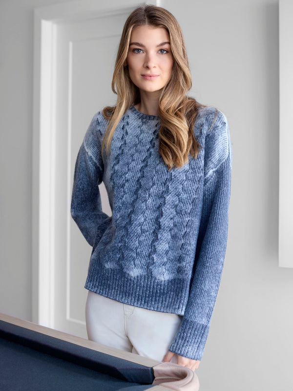 Versatile blue sweater featuring ribbed cuffs for added comfort and a snug fit during chilly days by Charlie B.