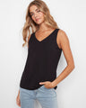 Black bamboo cami featuring a flattering scoop neckline, adding elegance to any outfit by Charlie B.