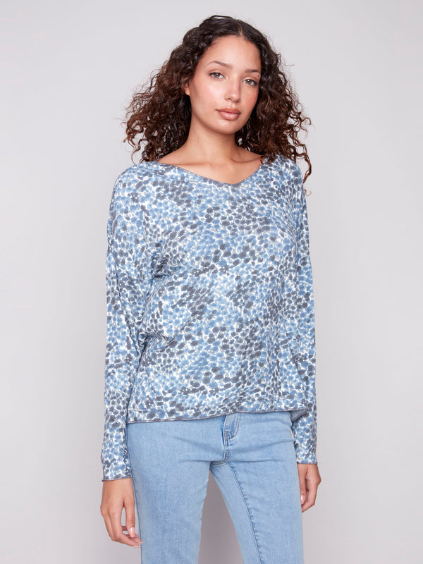 Blue knit top with relaxed fit and ditsy print, perfect for casual wear by Charlie B.