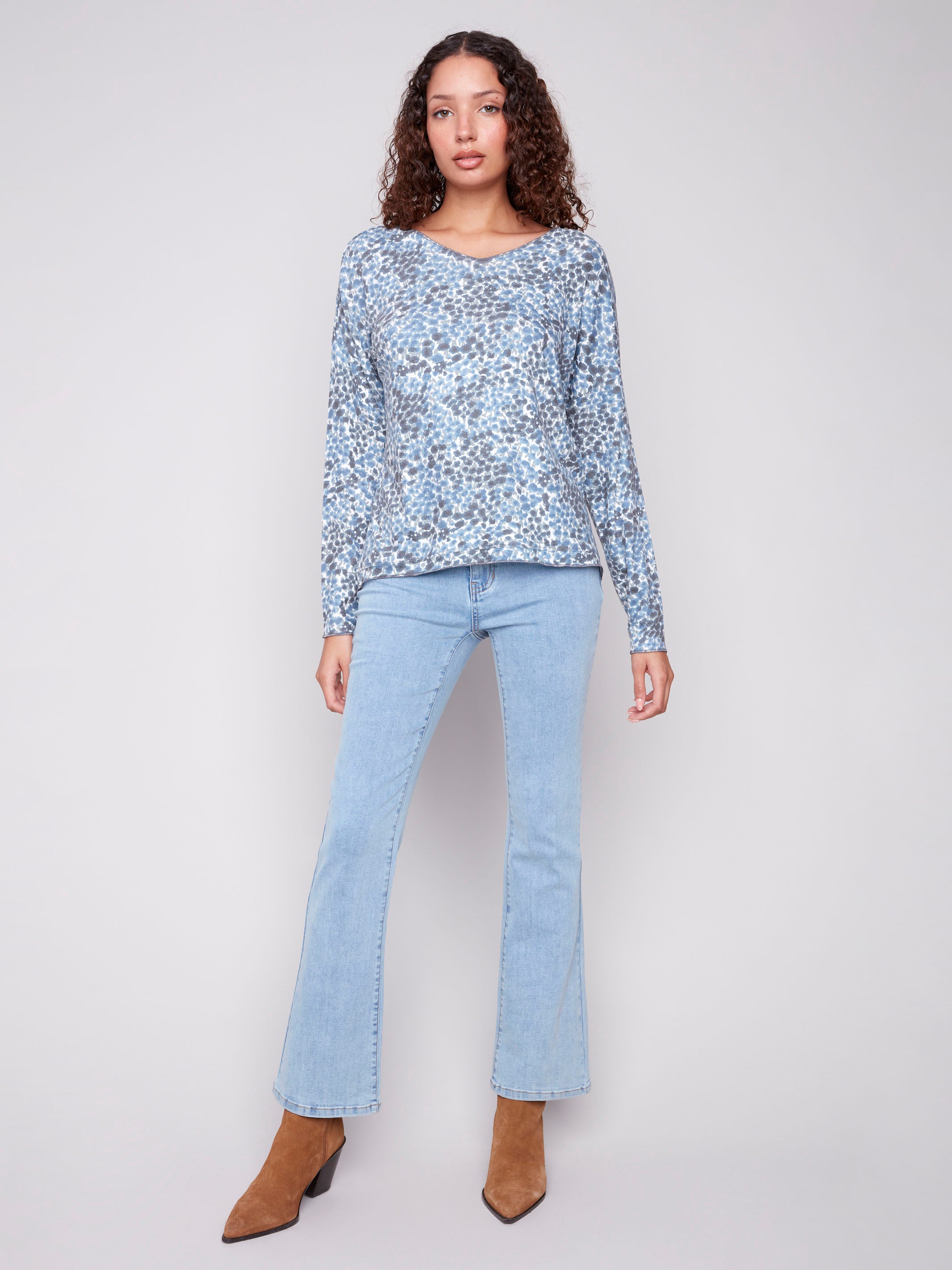 Stylish blue top featuring drop shoulders and a charming ditsy pattern by Charlie B.