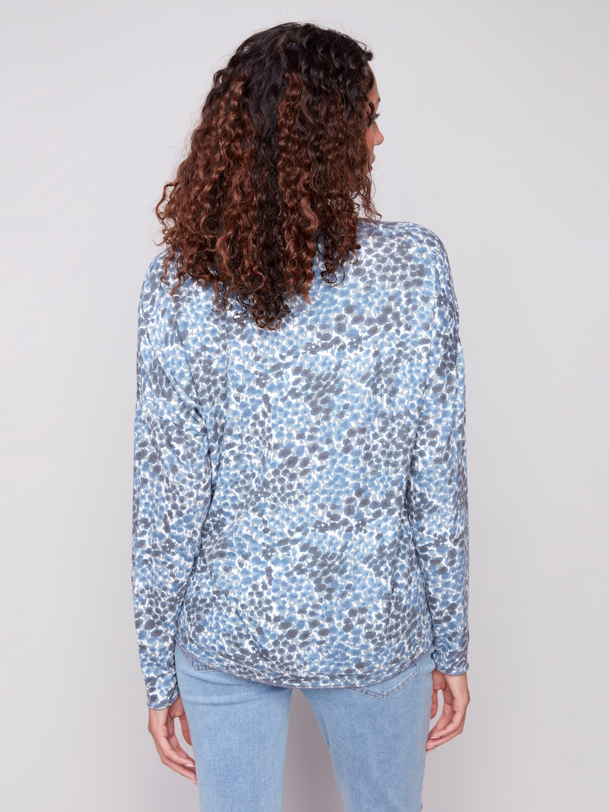 Fashionable knit top in blue with eye-catching ditsy print and long sleeves by Charlie B.