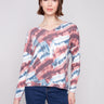Pink tie-dye knit top featuring a relaxed fit with a V-neck design, perfect for casual wear by Charlie B.