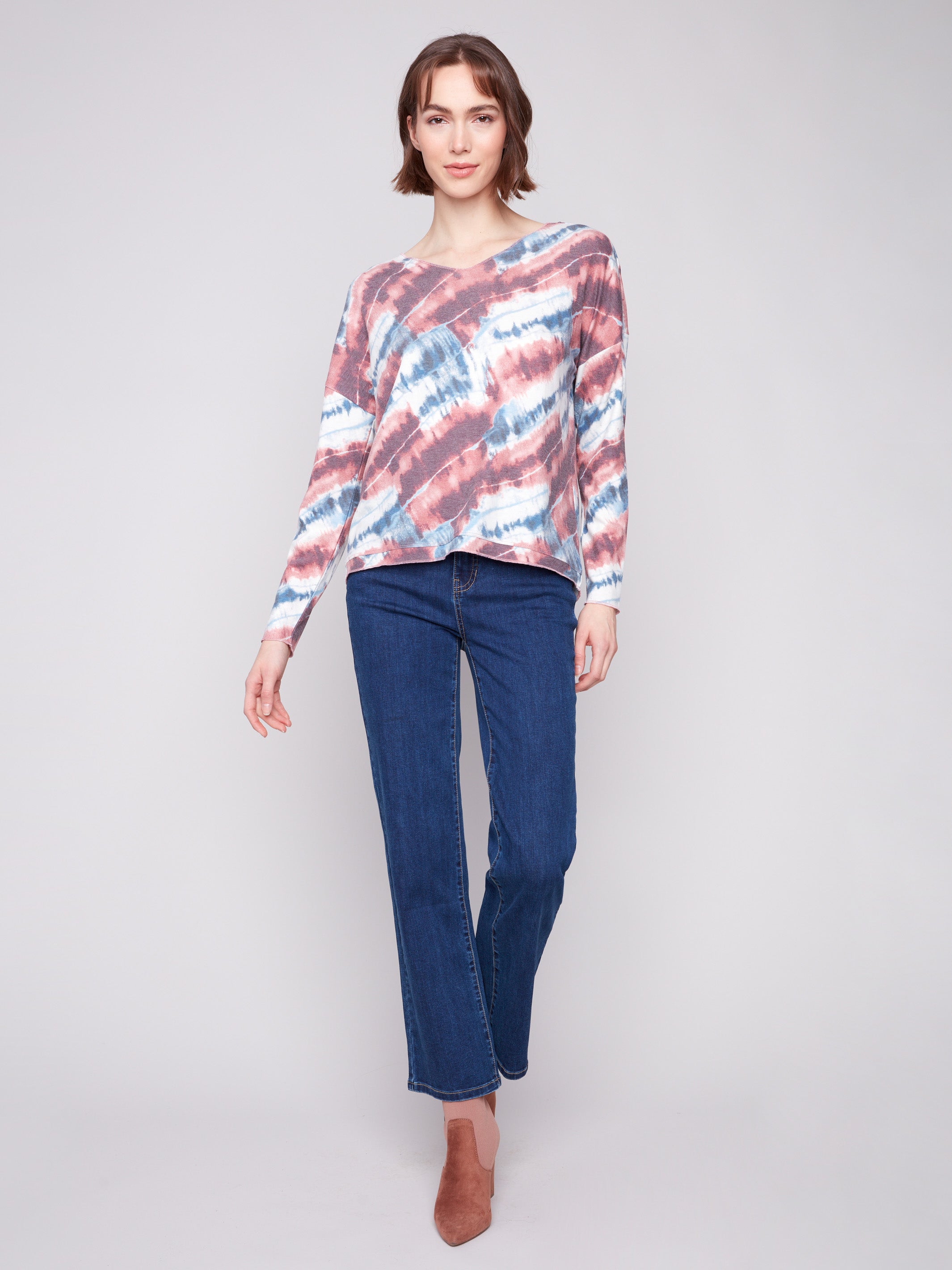 Stylish pink knit top in tie-dye pattern, showcasing drop shoulders for added comfort by Charlie B.