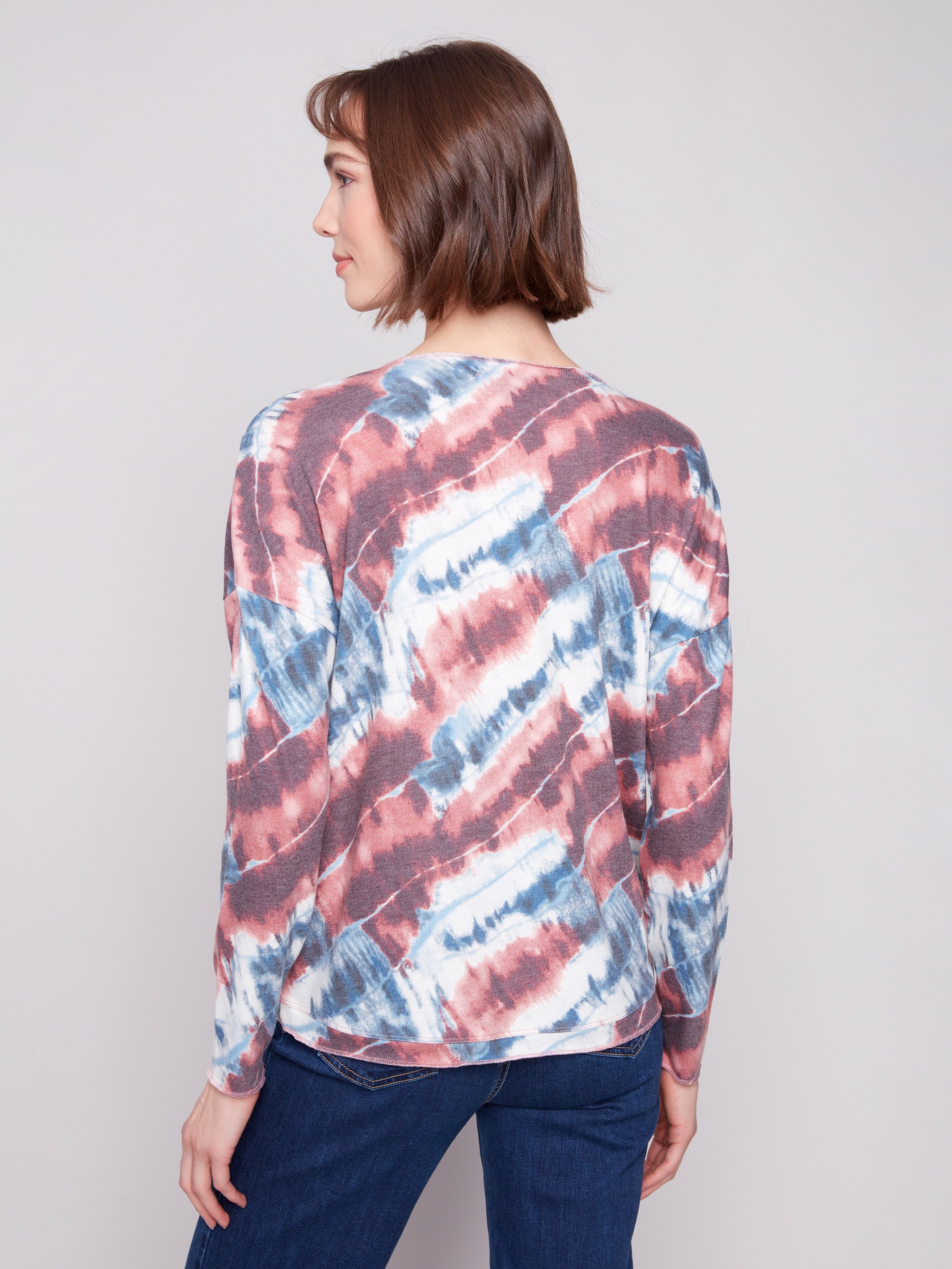 Chic pink long-sleeved knit top with unique tie-dye print and relaxed silhouette by Charlie B.