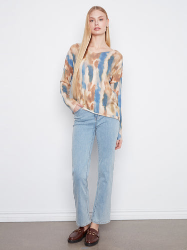 This long-sleeve knit top features drop shoulders and an abstract design in earthy hues, ideal for layering by Charlie B.