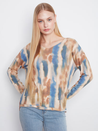 Stylish knit top featuring an abstract pattern in blue shades, complete with drop shoulders for added comfort by Charlie B.