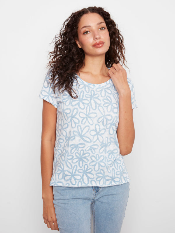 The soft blue tones of this 100% cotton top make it an easy choice for any wardrobe. Relaxed fit designed by Charlie B.
