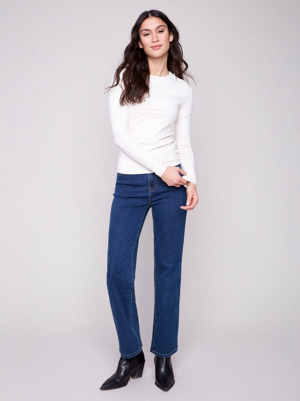 Natural long-sleeve top with a crew neck, featuring a sleek fit and super stretchy fabric by Charlie B.