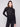 Elegant black lace top featuring long sleeves and a fitted silhouette, perfect for any occasion by Charlie B.
