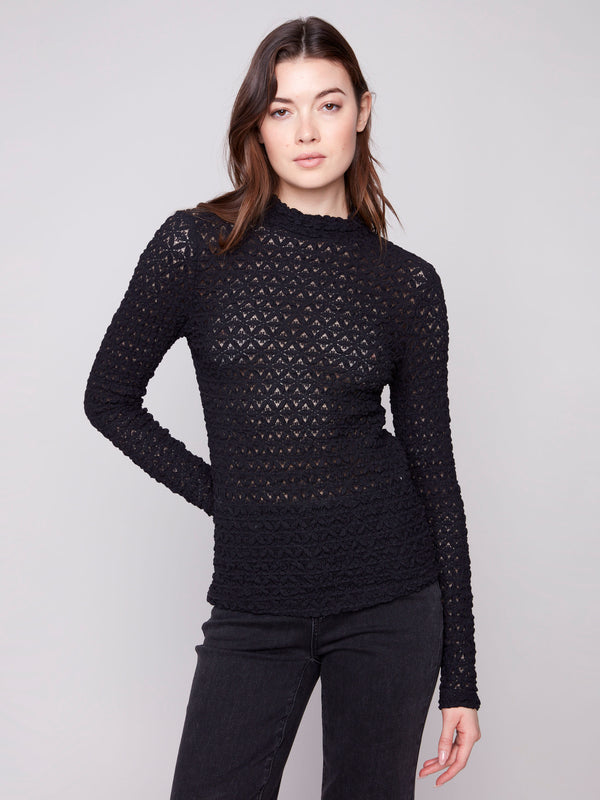 Elegant black lace top featuring long sleeves and a fitted silhouette, perfect for any occasion by Charlie B.